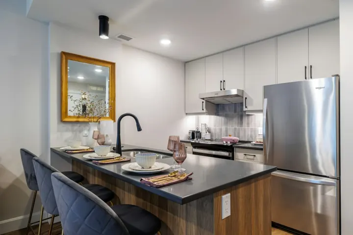 Modern apartment kitchen with an island and stools